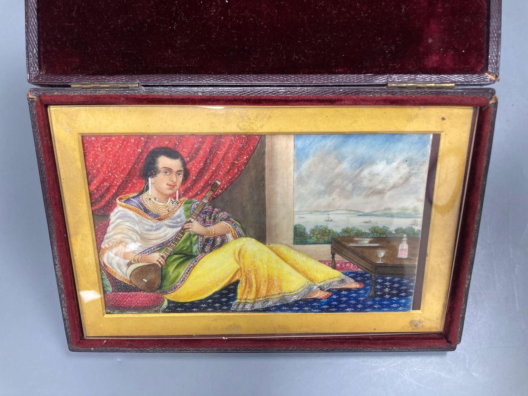 A late 19th century Indian School, gouache, lady playing a sitar